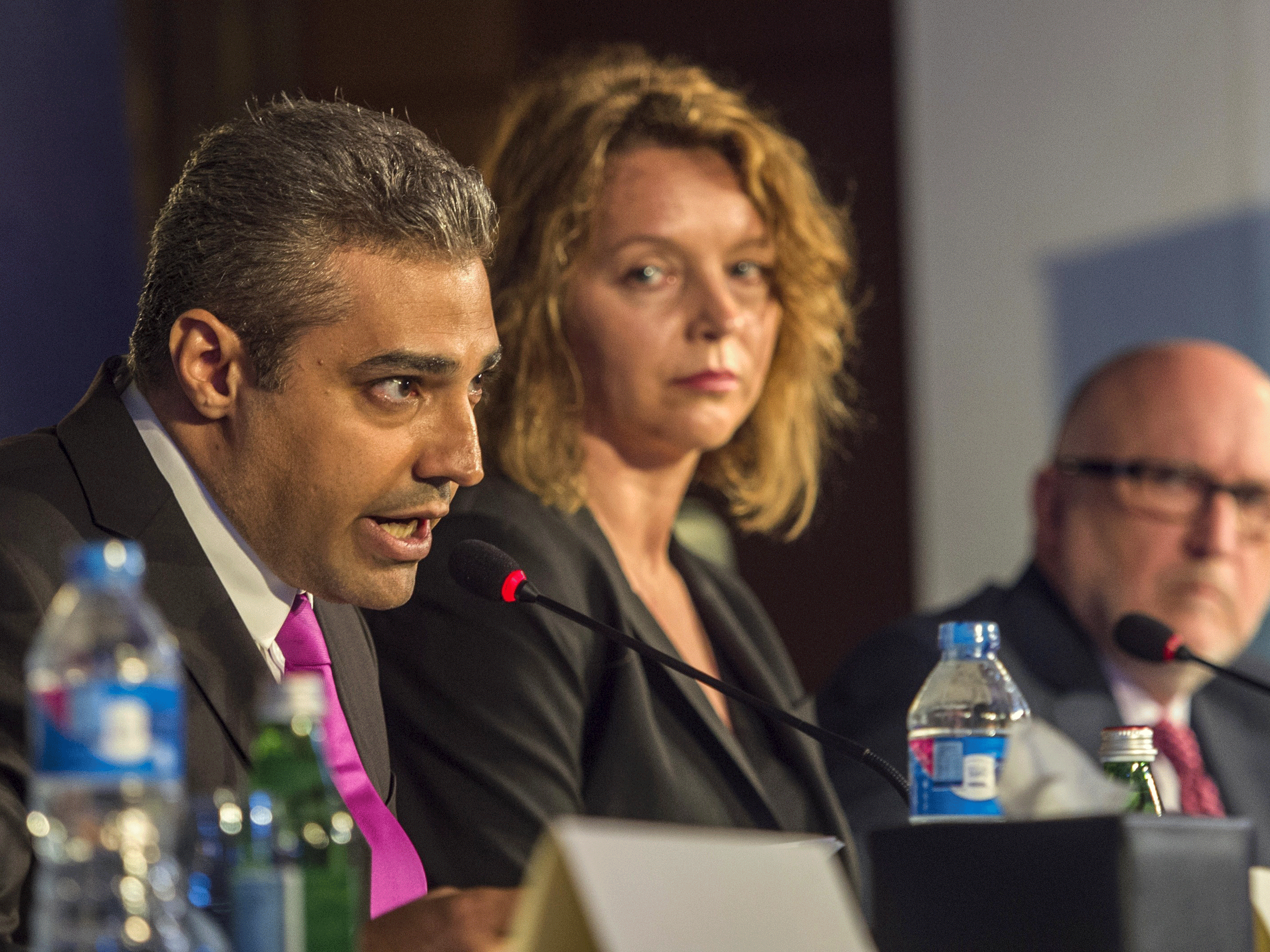 Egyptian-Canadian journalist Mohamed Fahmy (left), formerly with Al Jazeera, and his Canadian defence team lawyers Joanna Gislason and Gary Caroline